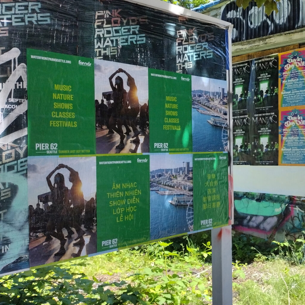 This is an image of the signage of Pier 62 events in different languages